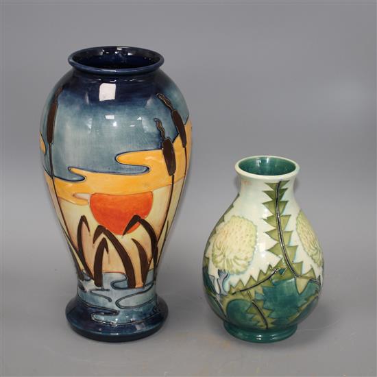 Two modern Moorcroft vases, one decorated with bulrushes and sunset, height 31cm, the other with stylised dandelions, height 19cm